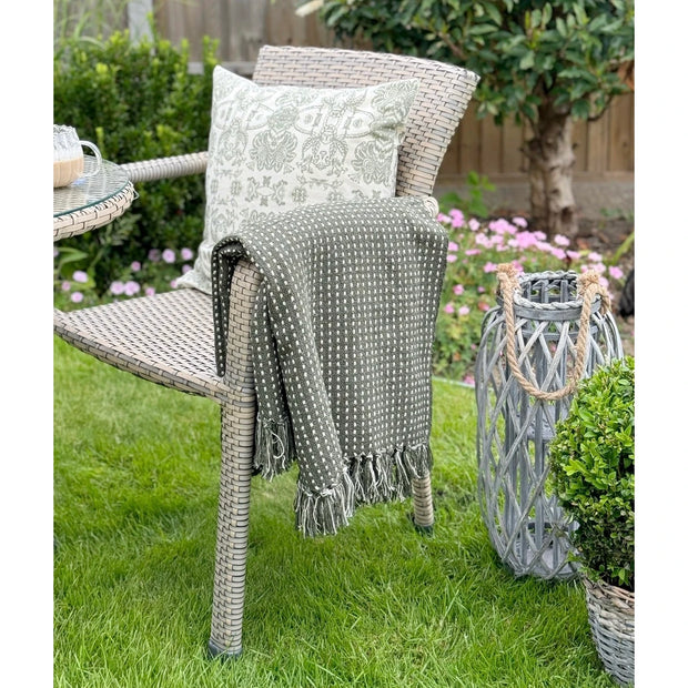 Olive green cotton throw blanket with stab stitch design from Gisela Graham, soft furnishings for cozy home decor.