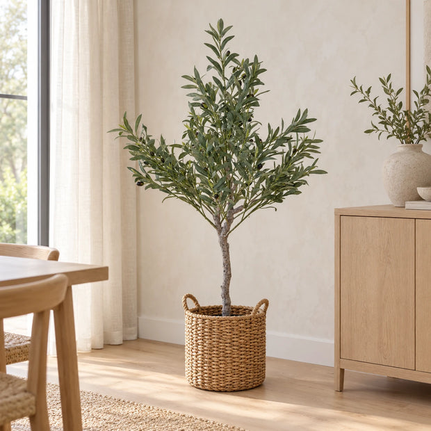 Small artificial olive tree by Satchville, 120cm tall, with realistic green leaves in a modern room setting.