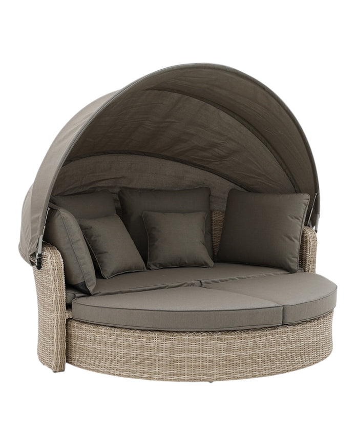 Natural rattan day bed from Pacific Lifestyle Ltd garden furniture set with cushions, ideal for outdoor relaxation.