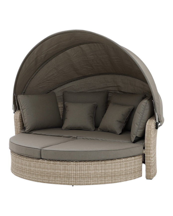 Natural rattan day bed from Pacific Lifestyle Ltd, part of a garden furniture set, perfect for outdoor relaxation.