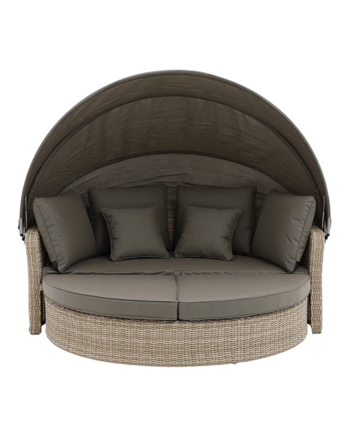 Natural rattan day bed from Pacific Lifestyle Ltd garden furniture set, featuring plush cushions and a stylish outdoor design.