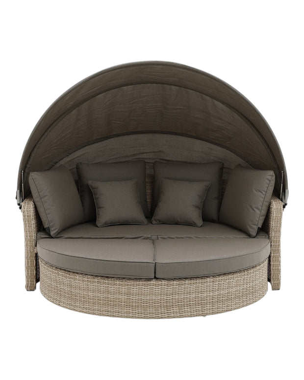 Natural rattan day bed from Pacific Lifestyle Ltd garden furniture set, featuring plush cushions and a stylish outdoor design.