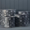 Set of four vintage bee-themed metal planter pots by Satchville, cylindrical baskets perfect for indoor or outdoor plants.
