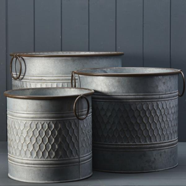 Set of three rustic zinc metal planter pots with embossed honeycomb pattern