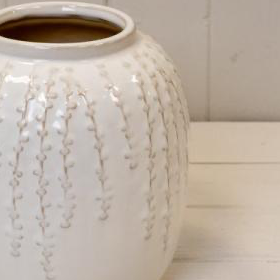 Small cream ceramic ribbed vase by Satchville, featuring a textured ribbed surface for elegant home decor.