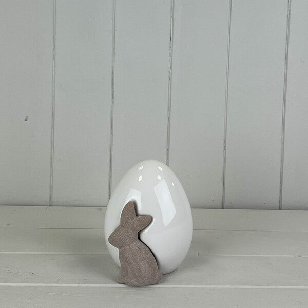White ceramic egg with a bunny rabbit design, perfect for spring decorations by Satchville