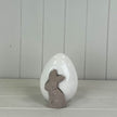 White ceramic egg with rabbit decoration for spring by Satchville, featuring a smooth, glossy finish and detailed rabbit design.