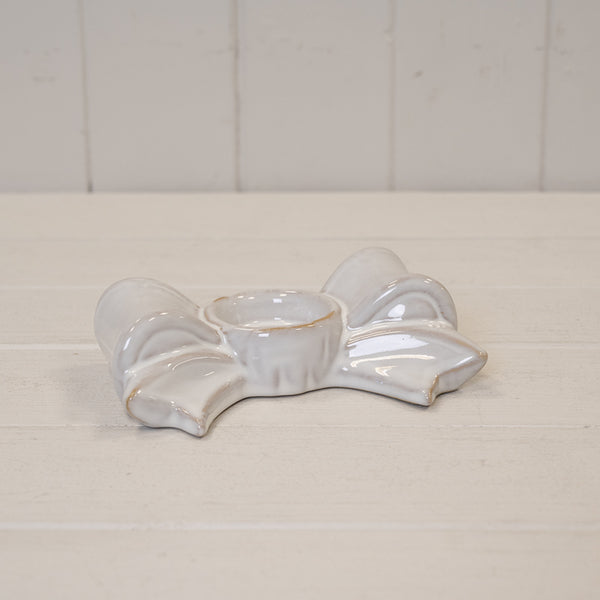 Original natural ivory ceramic bow tealight holder with sculpted loops, tails and empty central cup