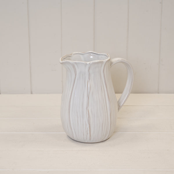Large natural ceramic jug with petal-shaped design, ideal for home decor, by Satchville.