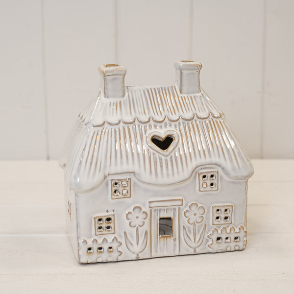 Natural ceramic thatch roof house for tealight, Satchville home decor piece with detailed thatched roof and cozy design.