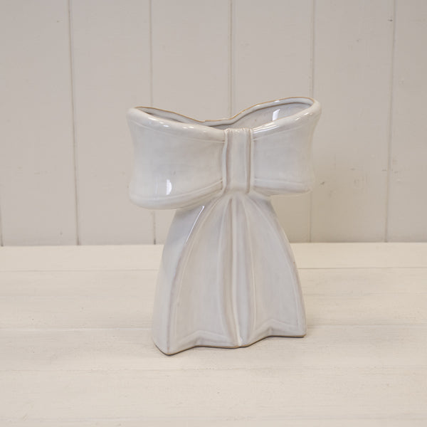 Large white ceramic bow-shaped vase by Satchville, ideal for home decor, showcasing smooth glossy finish and elegant design.
