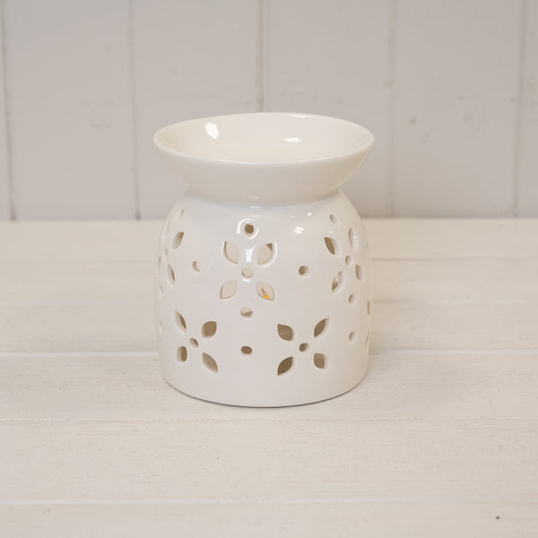 Large white ceramic oil burner with glazed finish and flower petal design by Satchville, featuring a decorative flower pattern.