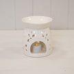 Large white ceramic oil burner with glazed finish and flower petal design, perfect for aromatic oil diffusing.
