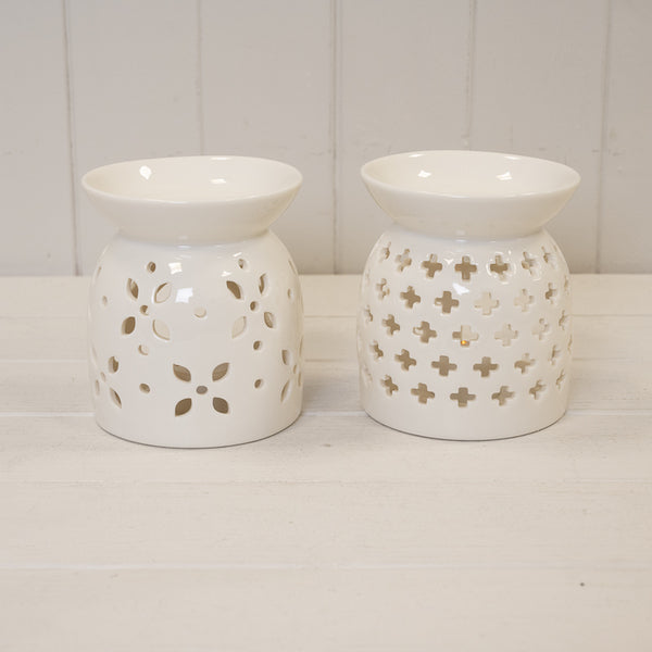 Large white ceramic oil burner with glazed finish and delicate flower petal design, perfect for aromatherapy.