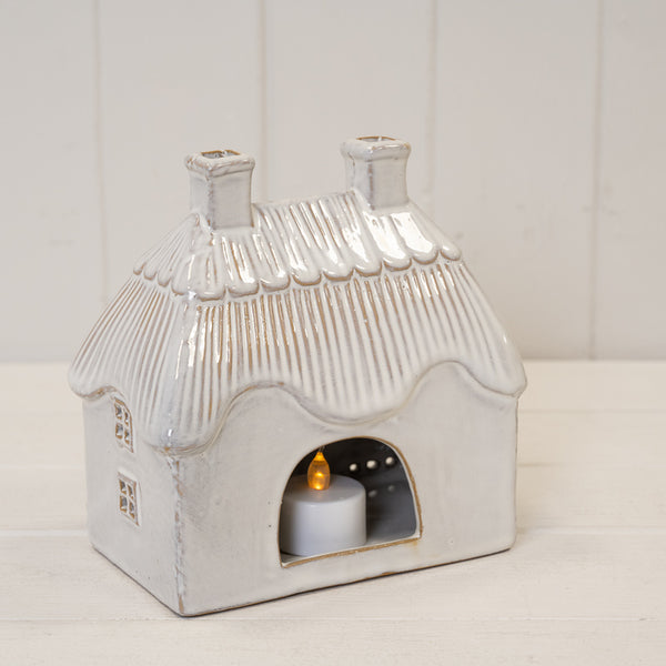 Natural ceramic thatch roof house for tealight, Satchville home decor, featuring a miniature rustic house with a thatched roof.