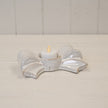 Original product photograph of the natural ceramic bow tealight candle holder