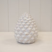 Large natural ceramic pinecone decoration with ivory glaze and layered ridged scales
