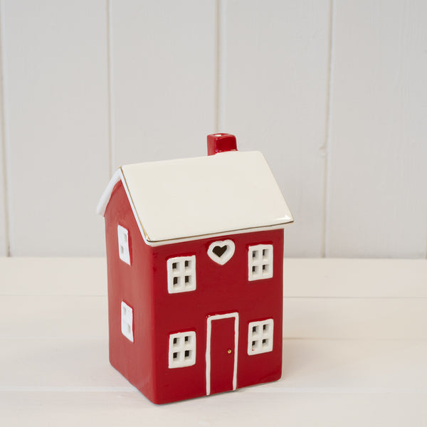 Tall red ceramic LED Christmas heart house by Satchville, featuring a festive heart-shaped design with glowing lights.