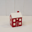 Red ceramic LED Christmas heart-shaped house by Satchville, featuring a cozy heart design and warm lighting.