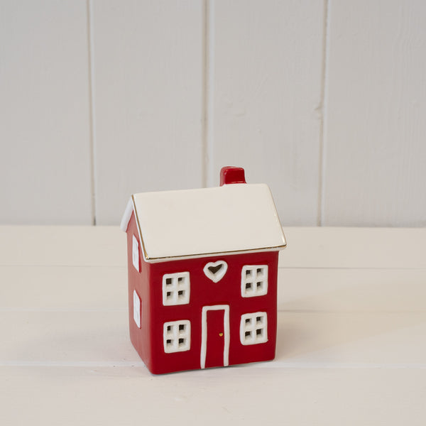 Red ceramic LED heart-shaped house for Christmas decor by Satchville, featuring a cozy festive design with glowing lights.