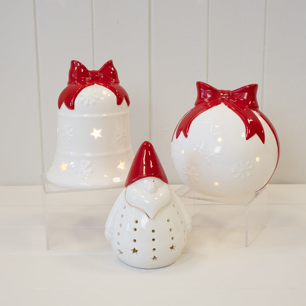White Christmas bauble with red bow from Satchville, festive holiday decoration, shiny round ornament for Christmas tree.