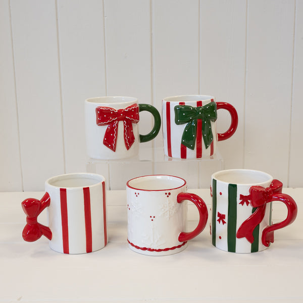 Red Christmas mug with detailed snowflake design by Satchville, perfect for holiday festivities.