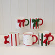 Red Christmas mug with detailed snowflake design by Satchville, perfect for holiday festivities.
