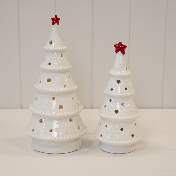 Large Satchville Winter Wonderland LED Christmas tree with star topper, decorated with lights for festive holiday display.