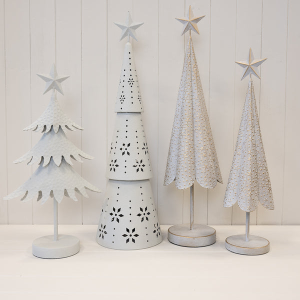 Collection of white metal Christmas tree decorations including gold star designs