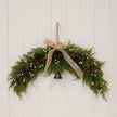 Arc Swag with White Berries, Pinecones with Bells and Bow Detail