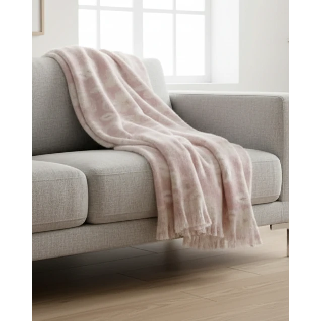 Pale pink floral faux mohair throw blanket from Malini, soft and cozy for home decor and comfort.