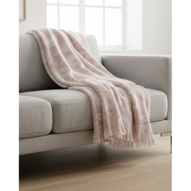 Pale pink floral faux mohair throw blanket from Malini, soft and cozy for home decor and comfort.