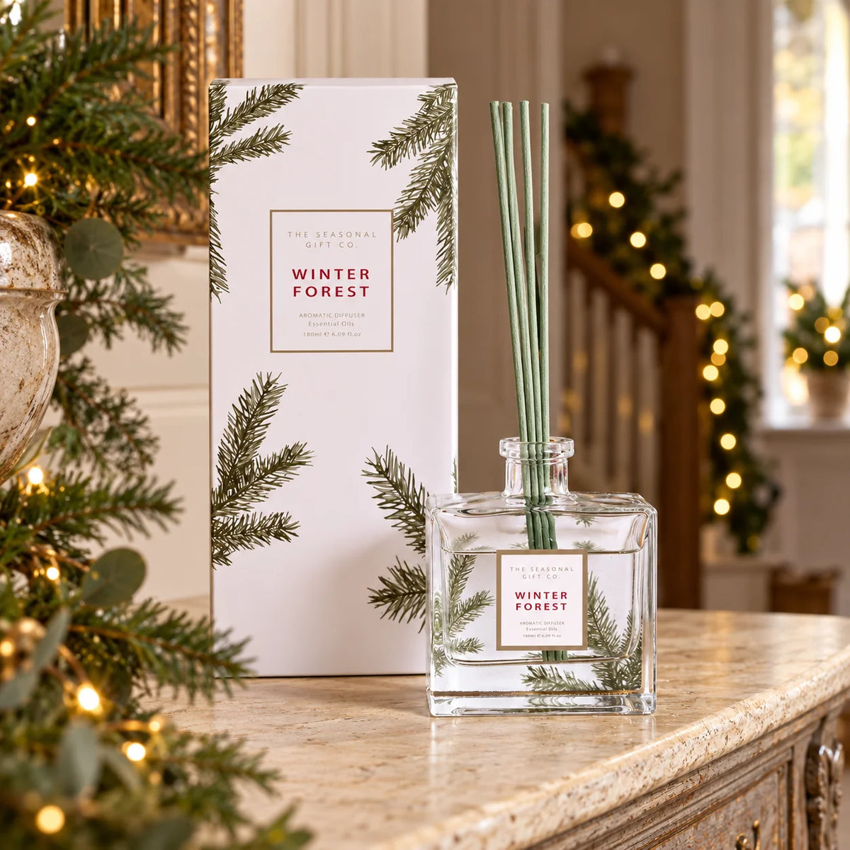 Pine Pattern reed diffuser and presentation box in a festive hallway