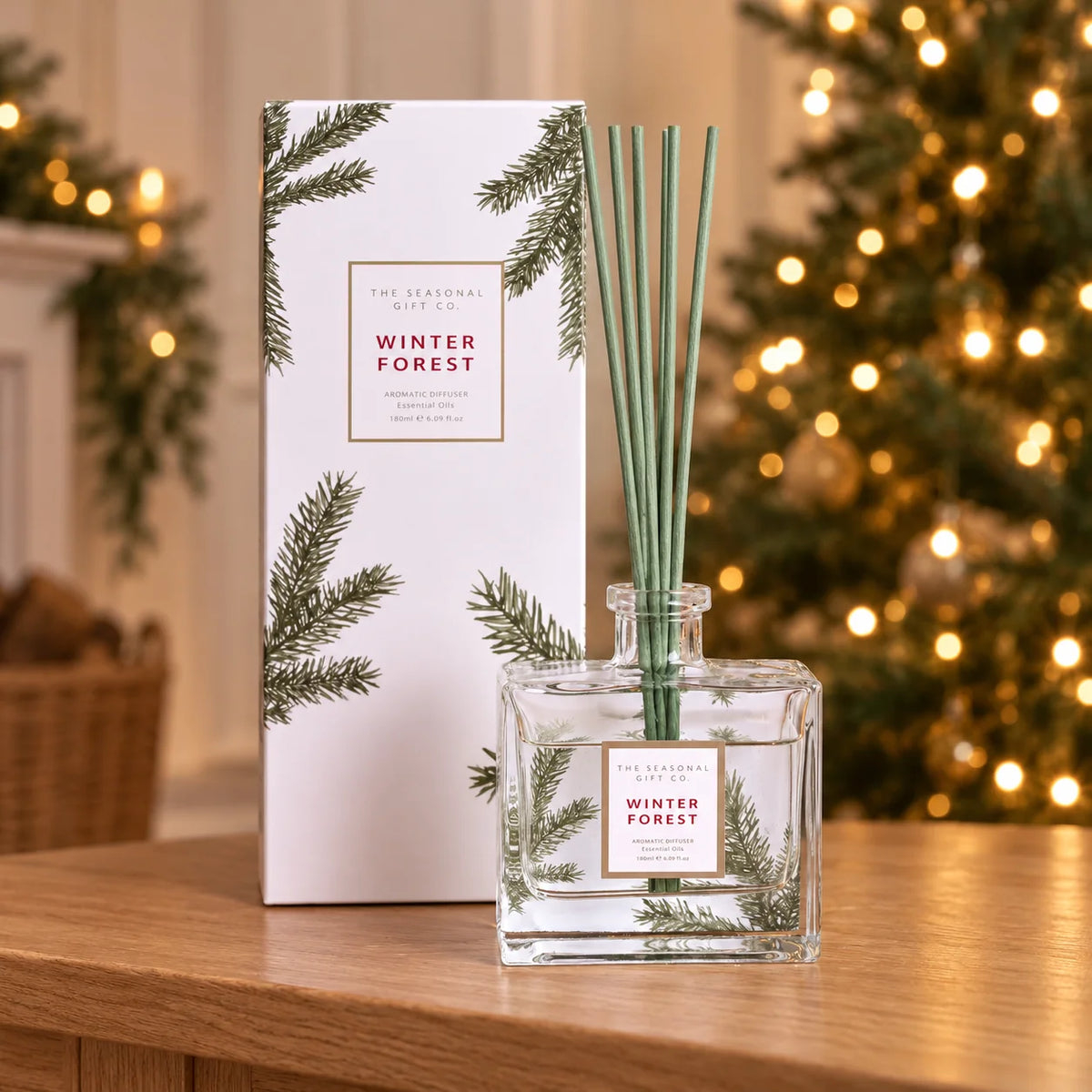 Pine Pattern Winter Forest reed diffuser with matching box on an oak console at Christmas