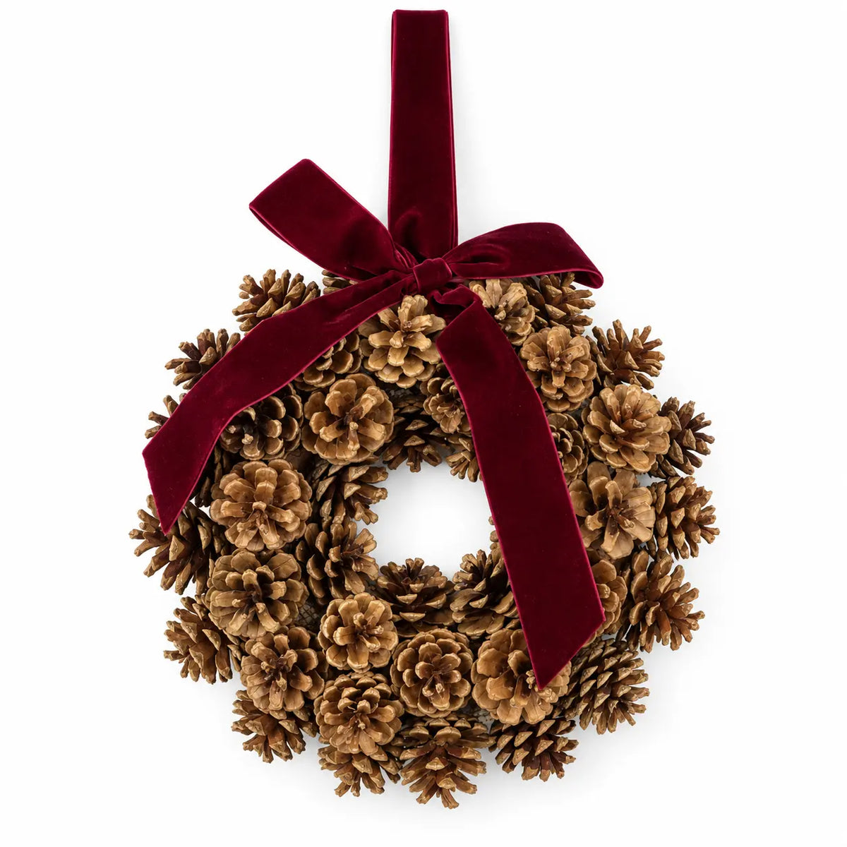 Pinecone wreath with burgundy velvet bow and hanging ribbon on a white background