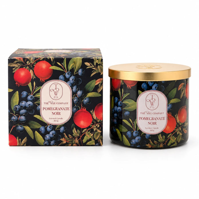 Pomegranate Noir lidded candle and matching box on a white background