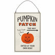 Pumpkin Patch wooden hanging sign with orange pumpkin illustration and wire hanger on white