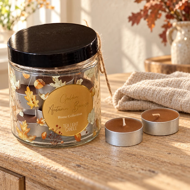 Set of 15 pumpkin-scented tealights in glass jars for autumn-themed decor by Gainsborough Giftware.