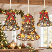 Set of three rattan LED Christmas bells with red bows hanging from an oak beam
