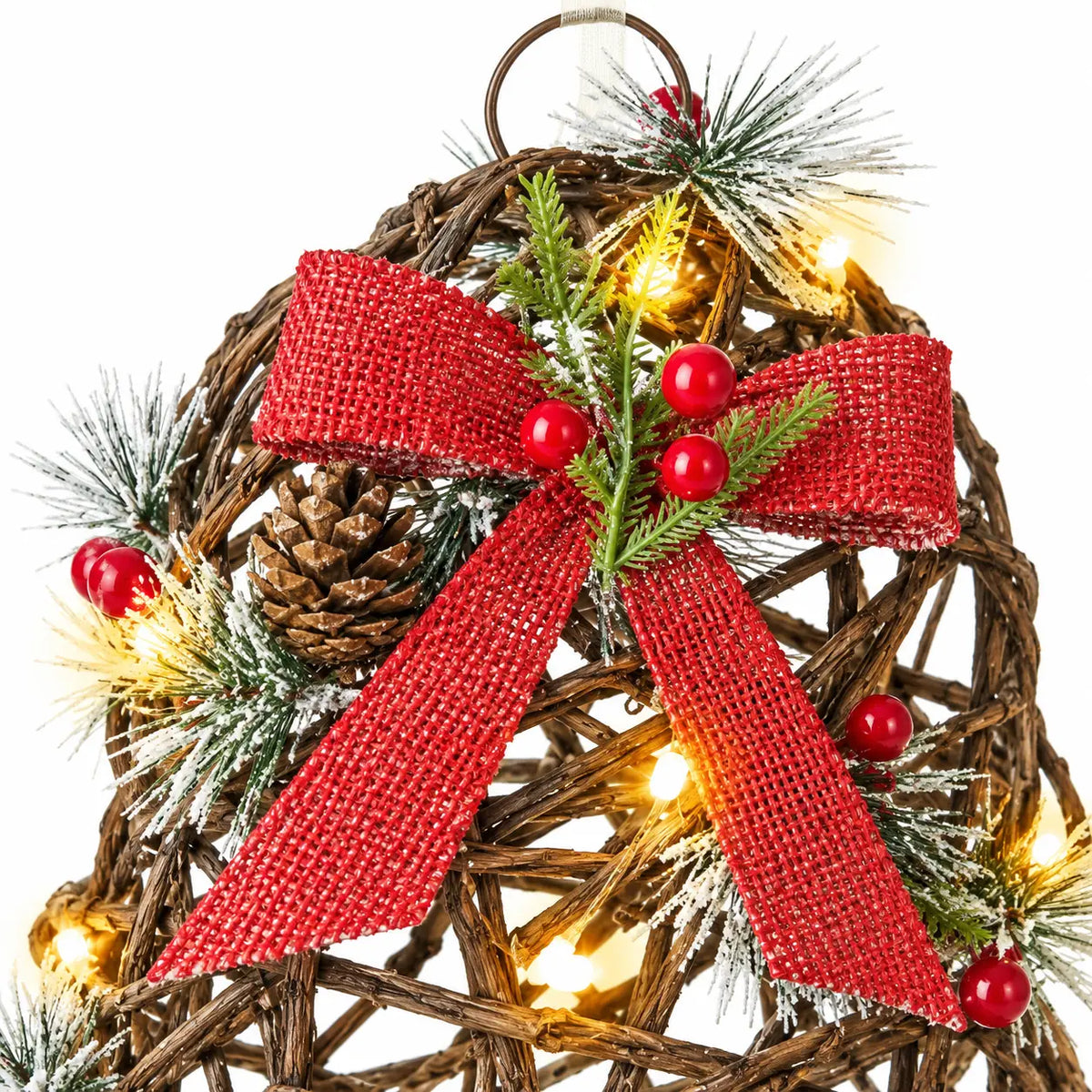 Close-up of red woven bow frosted foliage berries and lights on a rattan bell