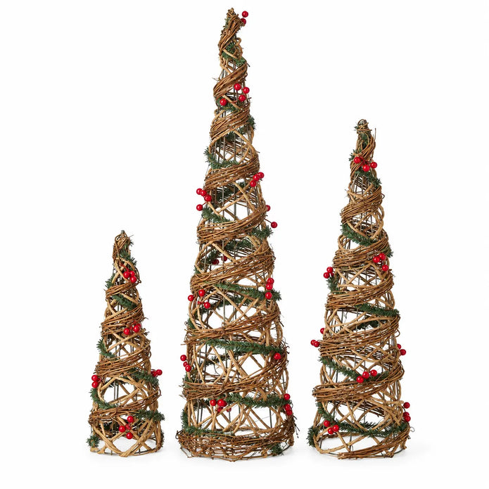 Set of three rattan cone trees on a white studio background