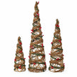 Set of three rattan cone trees on a white studio background