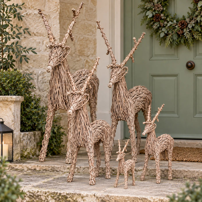 Pacific Lifestyle rattan standing outdoor Christmas reindeer decoration on a porch