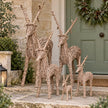 Pacific Lifestyle rattan standing outdoor Christmas reindeer decoration on a porch