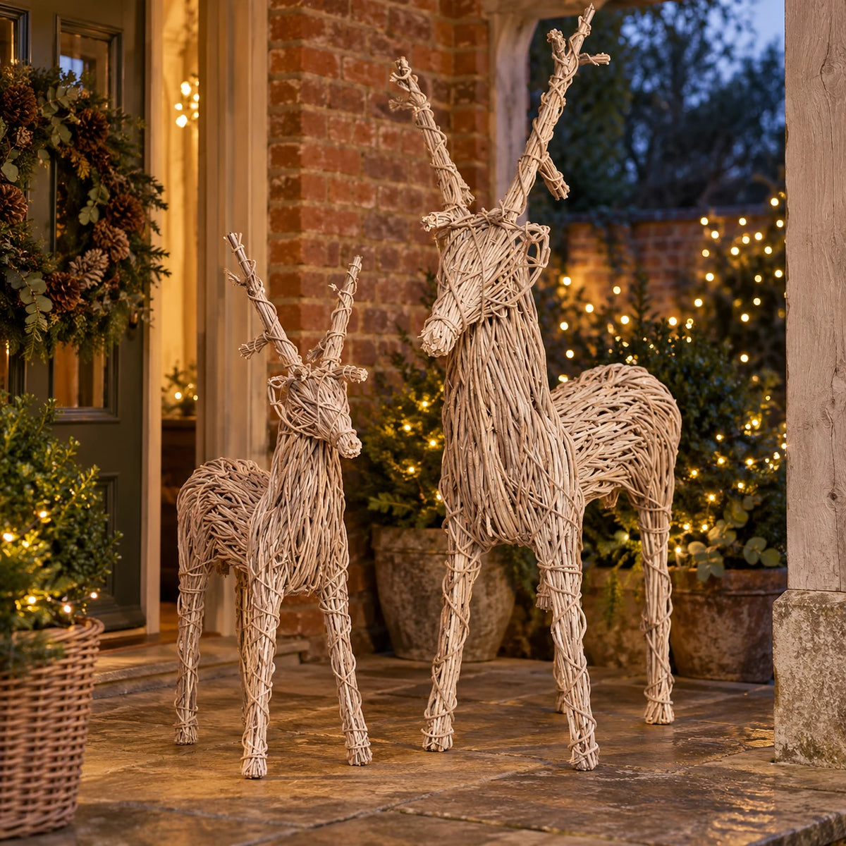 Rattan standing outdoor reindeer by Pacific Lifestyle Limited displayed on a porch at dusk