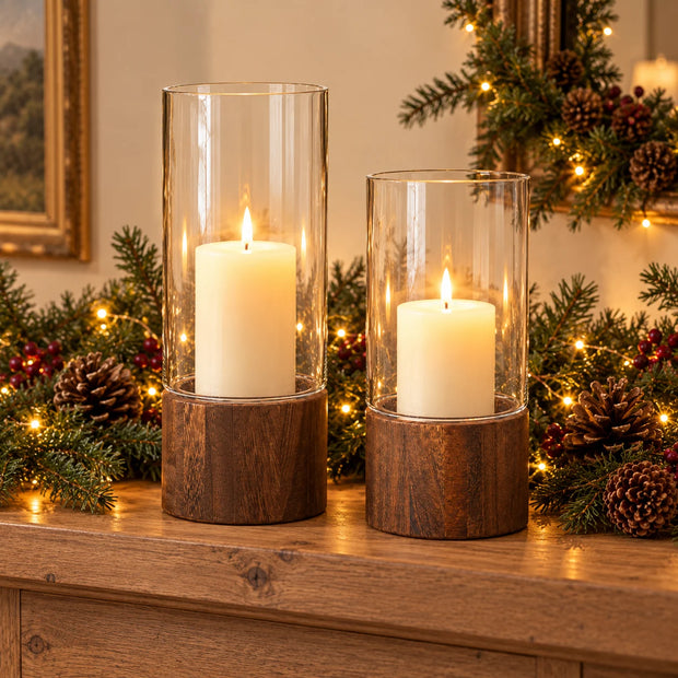 Raya clear glass and dark wood lanterns in Large and Small, shown together with candles and Christmas greenery; sizes sold individually