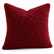 Angled studio view showing the red burgundy cushion cover’s looped bouclé texture