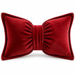 Front studio view of the red corduroy striped bow cushion on a white background.