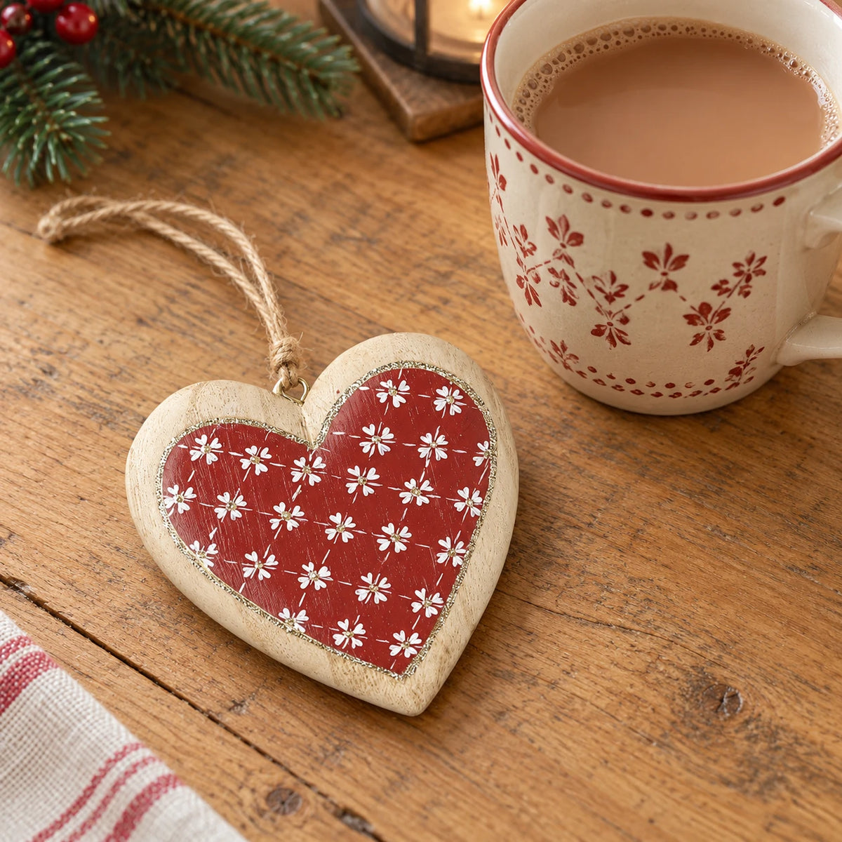 Red and cream heart Christmas decorations by Heaven Sends displayed on a kitchen scale