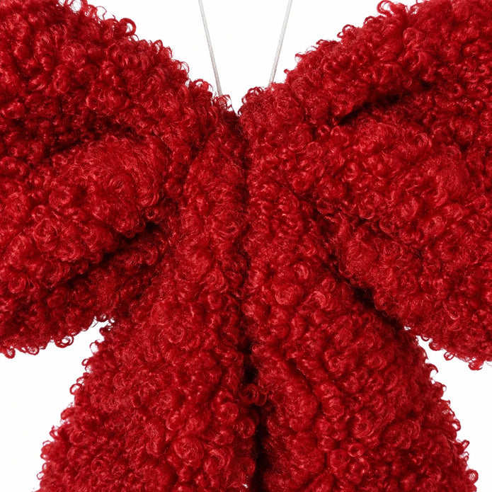 Red fluffy bow hanging decoration for Christmas by Heaven Sends, featuring soft, plush texture and festive holiday charm.